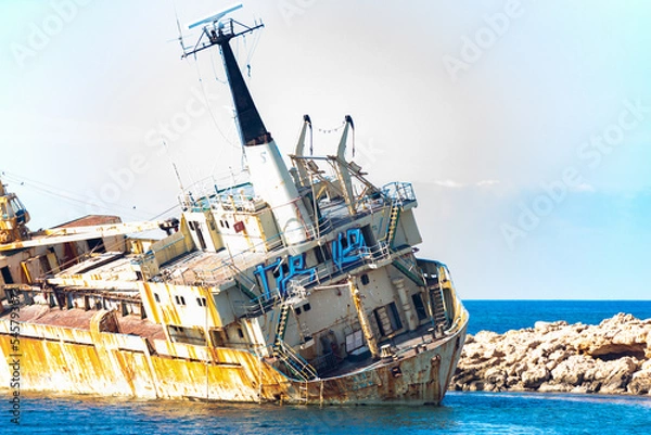 Fototapeta A large cargo ship that ran aground in the Sea Caves area of Paphos County, near Coral Bay, during a storm on December 8, 2011 after an engine failure.