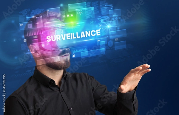 Fototapeta Businessman looking through Virtual Reality glasses