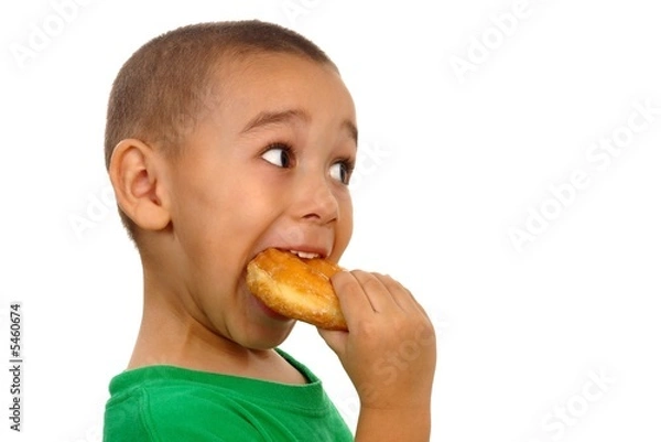 Obraz Boy eating a donut