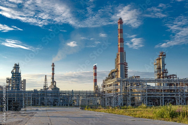 Fototapeta modern oil refinery against the background of the sky and clouds