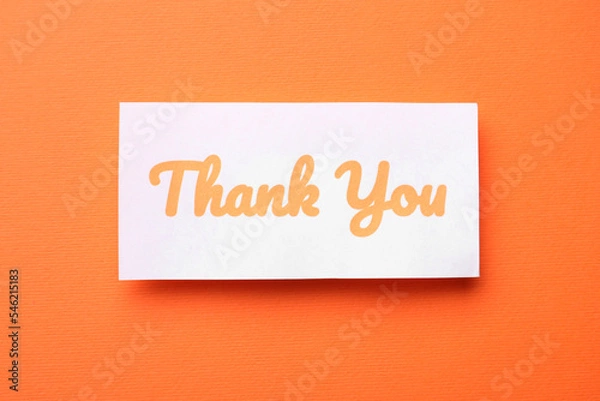 Fototapeta Note with phrase Thank You on orange background, top view
