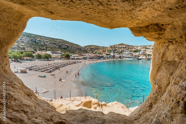 Fototapeta matala beach, crete island, greece: sceniv view from famous caves to the beautiful coast and village