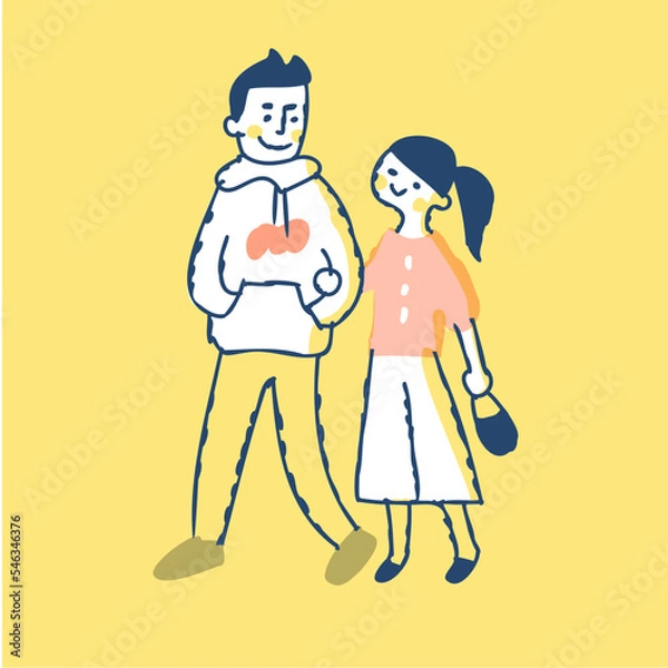 Fototapeta 腕を組んで歩く若いカップル