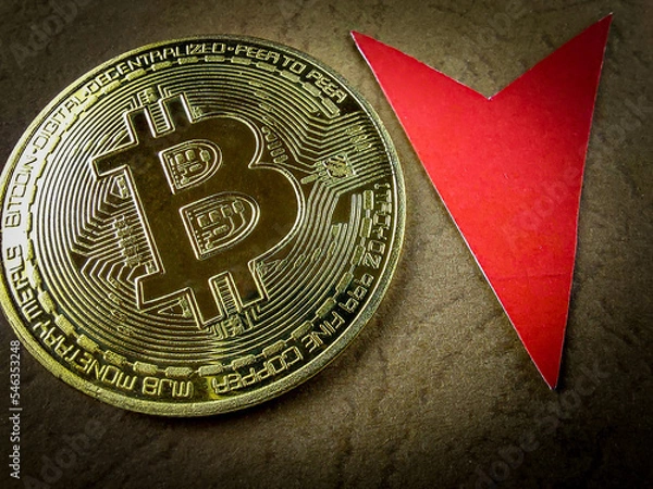 Fototapeta Bitcoin price drop concept. Red arrow pointing down. The collapse of the cryptocurrency market. Electronic money. Risky investment. Bankruptcy.