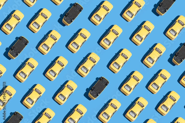 Obraz Abstract automotive concept. Yellow isolated cars on bright blue background. Minimal technology idea, aesthetic pattern flat lay composition.