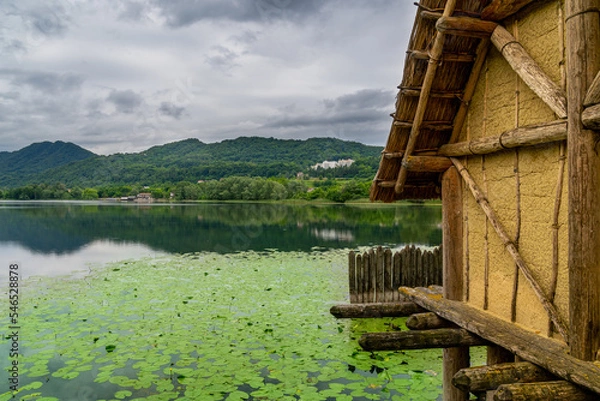 Fototapeta A hut next to a lake in an archaeological site in Lago di lago, Italy
