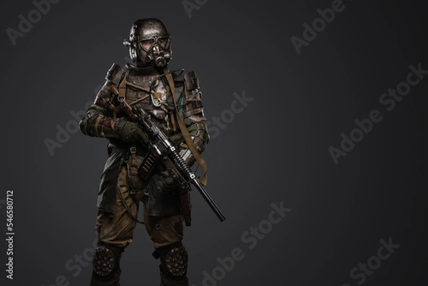 Obraz Portrait of soldier survived after atomic catastrophe with gas mask and shotgun.