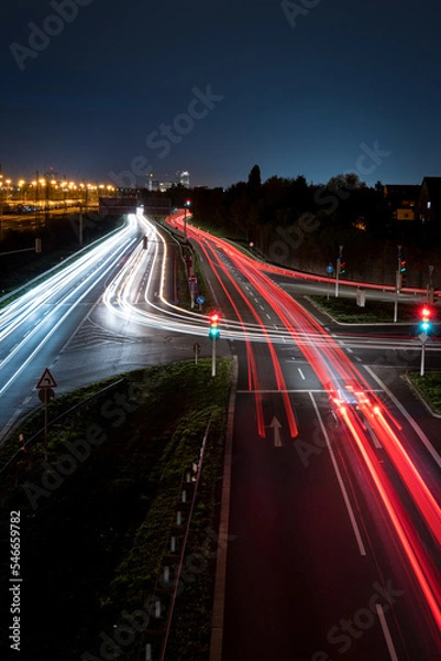 Obraz Long exposure of cars at a traffic light during nightfall 
