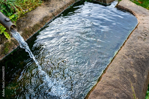 Obraz Traditional stone trough as a fointain with running water