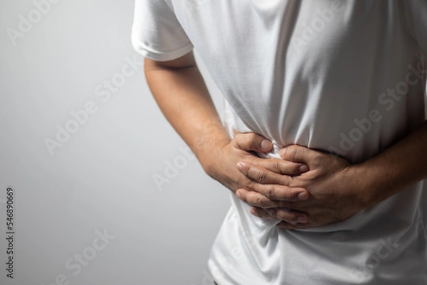 Obraz man having abdominal pain on white background