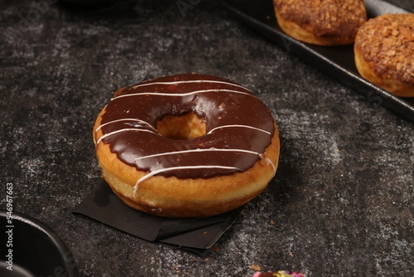 Fototapeta Delicious donut on a consistent ground and a distinctive product