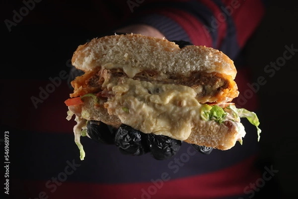 Fototapeta Homemade cheeseburger on an upscale table for lunch and dinner