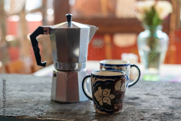 Obraz coffee maker on a table with mugs