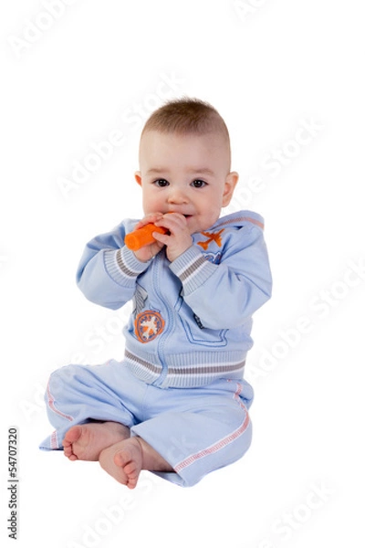 Obraz Smiling baby eats carrot