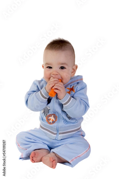 Obraz Smiling baby eats carrot