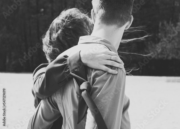 Obraz Close up hand with ring monochrome concept photo. Lady embraces her man. Sunny day. Back view photography with forest on background. High quality picture for wallpaper, travel blog, magazine, article