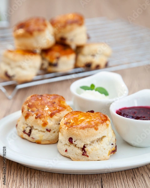 Obraz Cranberry scone set with raspberry jam and clotted cream