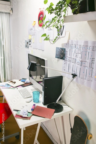 Obraz Modern creative workspace with computer and red chair.