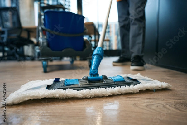 Fototapeta Work of cleaning company specialists in the coworking area