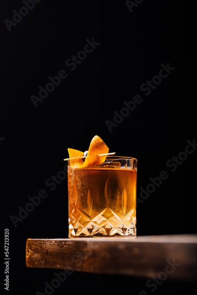 Obraz old fashioned cocktail classic bourbon whiskey and bitters, orange peel and cherry as garnish