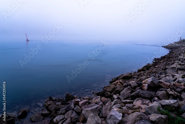 Obraz Riverbank in the dusk on a foggy day