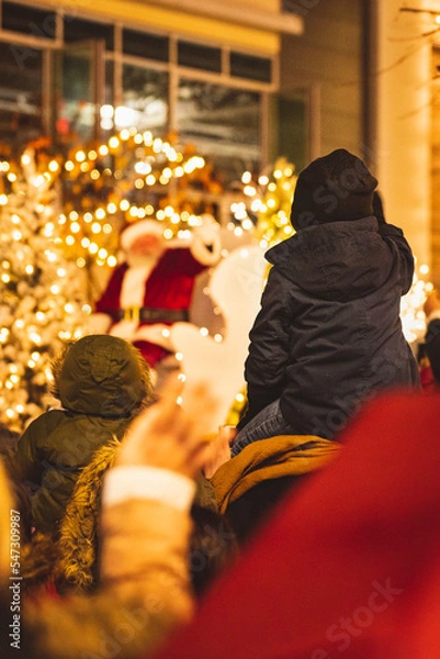 Fototapeta Child waving to santa	
