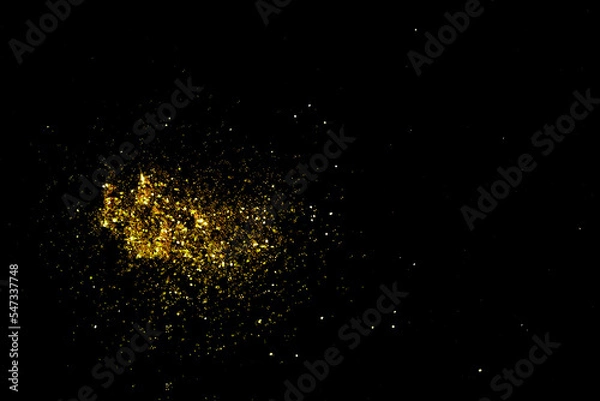 Obraz Gold glitter powder sparkling on black background.texture christmas