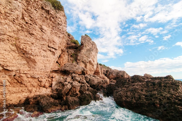 Fototapeta Cliffs and rocks on the sea coast.