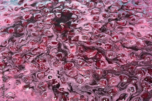 Obraz The texture is food-grade. Berries in the process of cooking cherry jam.