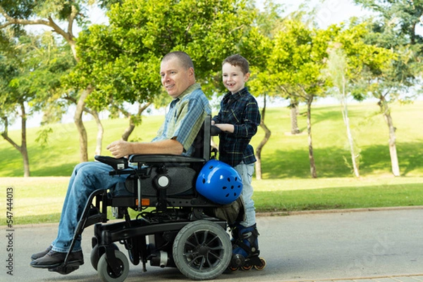 Fototapeta Disabled father is rollerblading with son
