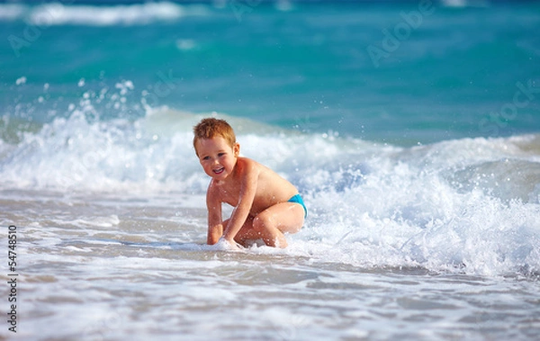 Obraz happy boy kid having fun in sea water