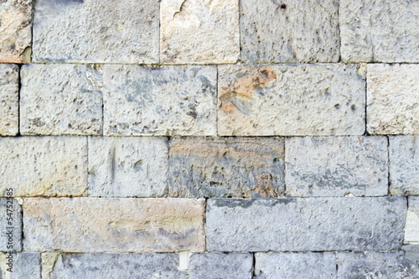 Fototapeta Part of a old stone wall, for background or texture.