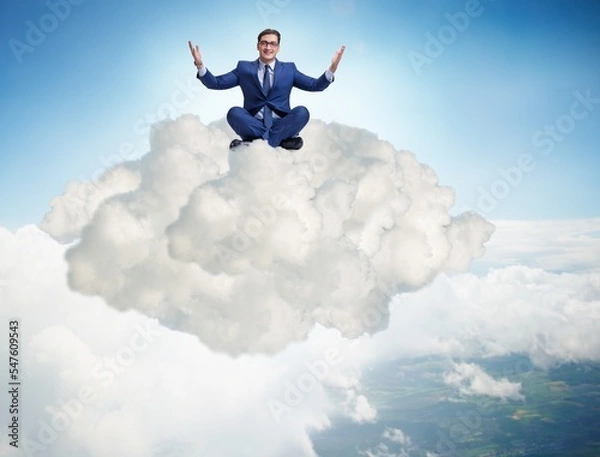 Fototapeta Businessman sitting at top cloud