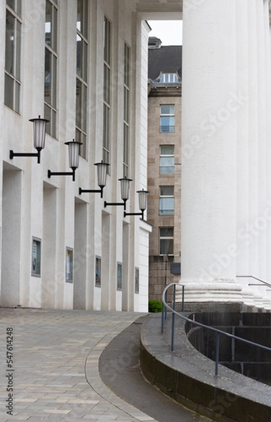 Obraz lamps on building wall with pillar