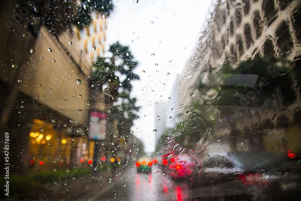 Fototapeta raining drops on the car window in the traffic jam city