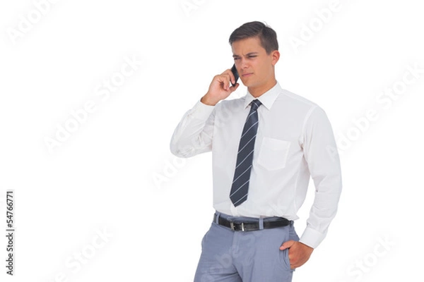 Obraz Unsmiling businessman on the phone