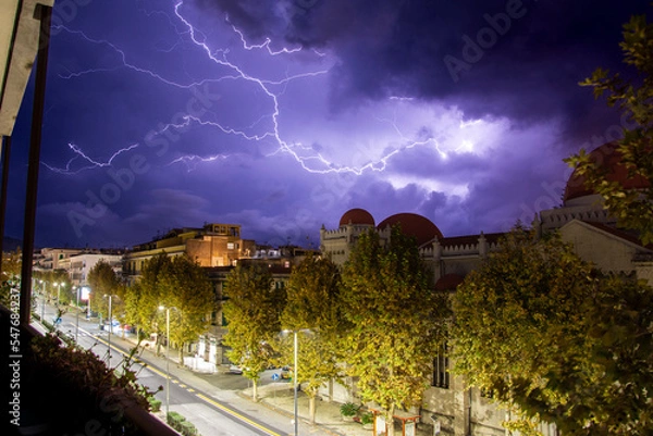 Obraz Fulmini con paesaggio urbano