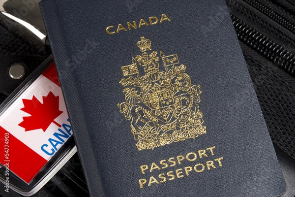 Obraz Closeup of Canadian passport sitting on suitcase