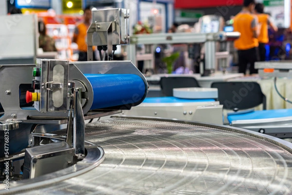 Fototapeta Rubber belt and stainless steel wire mesh conveyor of automatic production line of manufacturing process for transportation material goods or product etc. in industrial