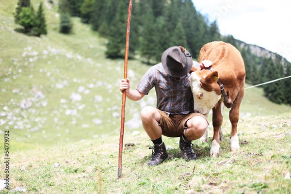 Fototapeta Hirte mit Kühen