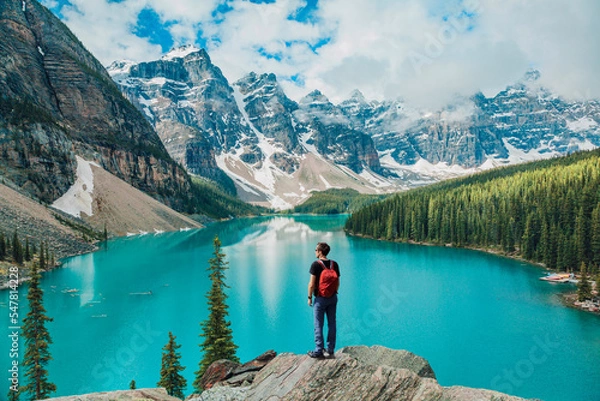 Fototapeta Canada travel man hiker at Moraine Lake Banff National Park, Alberta. Canadian rockies landscape people hiking with backpack lifestyle