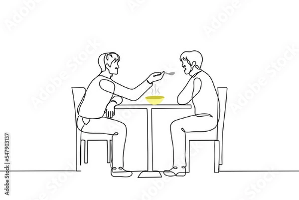 Fototapeta man sits at a table and feeds from a spoon another man sitting opposite him - one line drawing vector. concept of flirting homosexual men; feeding a person with a disability