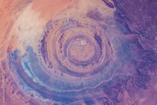Fototapeta Eye of the Sahara in northwestern Mauritania Aerial view of Sahara desert. Natural abstract patterns and shapes in the nature. Colorful background. Elements of this image furnished by NASA