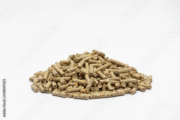 Fototapeta Fraction of feed additives for animals on a white background in the form of a pyramid