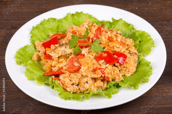 Fototapeta Rice with vegetables and chicken in a curry sauce