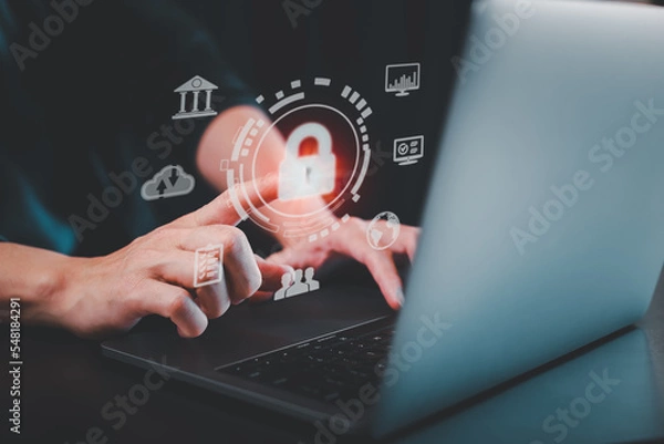 Fototapeta Cybersecurity and privacy concepts to protect data. Lock icon and internet network security technology. Businessman protecting personal data on internet with virtual screen interfaces.