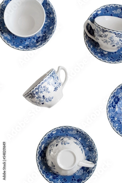 Obraz Ceramic saucers with a cup for tea in blue with flowers. New luxury elegance dinnerware. Trendy plate. Flat lay view. Transparent background.