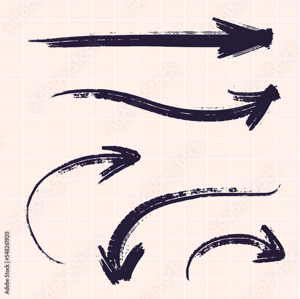 Obraz Vector arrows in different directions drawn with a brush by hand. Against the background of a checkered notebook.