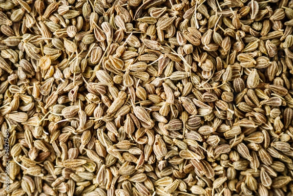 Obraz aromatic dry anise seeds on a dark black stone background