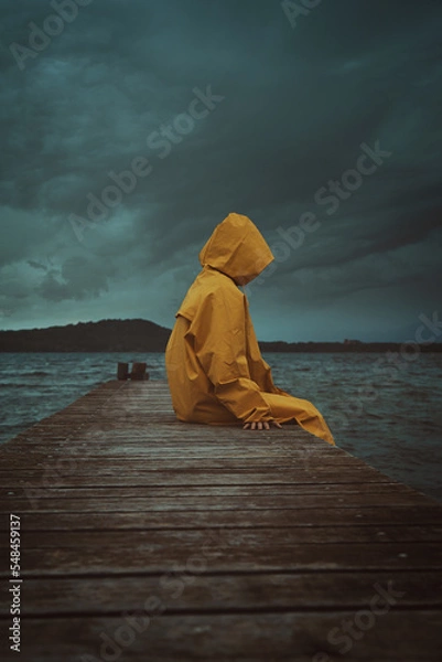 Fototapeta Mysterious figure with yellow coat